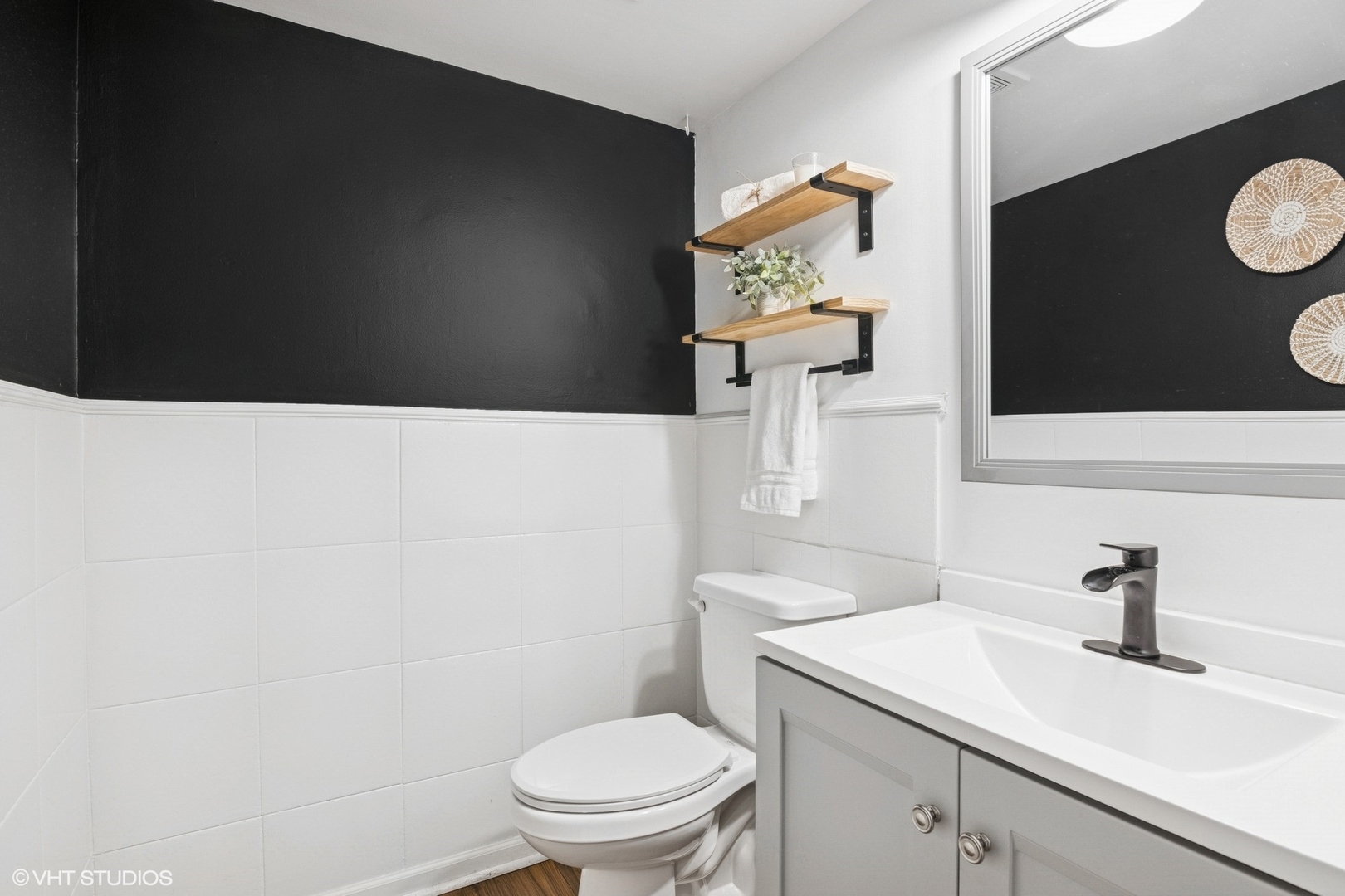 2421 Deerfield Drive Aurora, IL 60506 - Photo 10 of 22 a bathroom with a toilet a sink and mirror