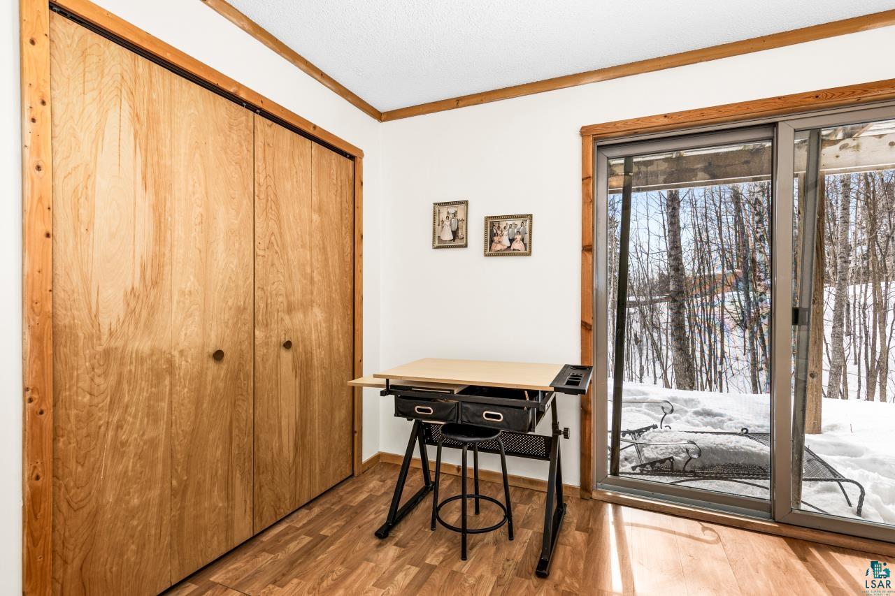 67 Snowshoe Trail Tofte, MN 55615 - Photo 36 of 42 Office with ornamental molding and wood finished floors