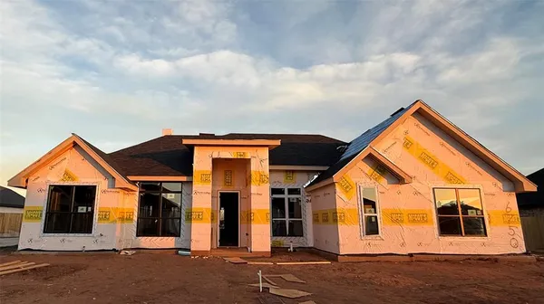 a front view of house with garage