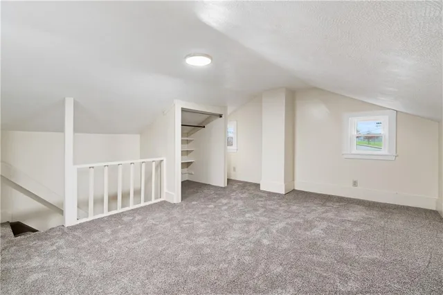 a view of a balcony with wooden floor