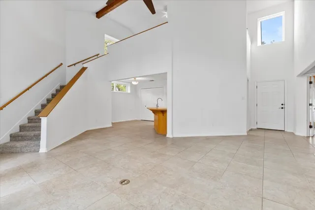 a view of an empty room with stairs