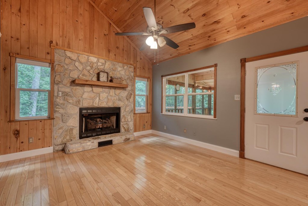 550 Watson Road Epworth, GA 30541 - Photo 16 of 63 a view of an empty room with a fireplace and a window