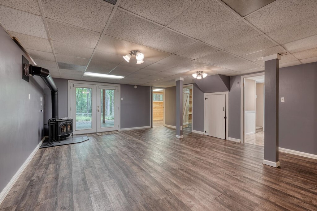 550 Watson Road Epworth, GA 30541 - Photo 32 of 63 a view of an empty room with wooden floor and a window