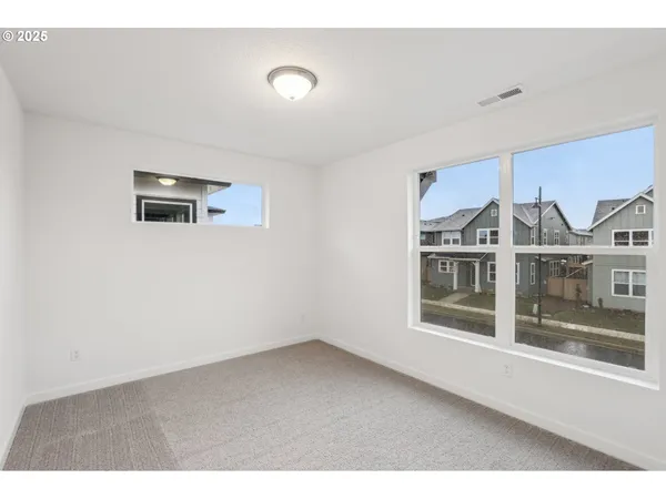 a view of empty room with windows
