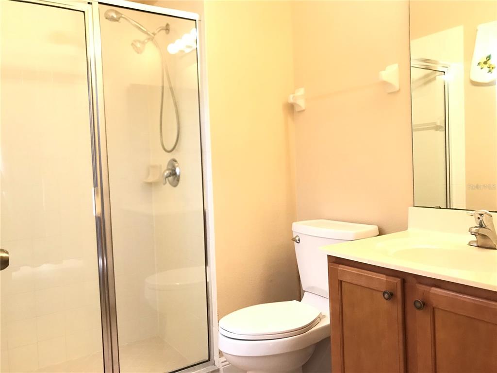 10505 Willow Ridge Loop Orlando, FL 32825 - Photo 23 of 45 a bathroom with a granite countertop sink toilet and shower