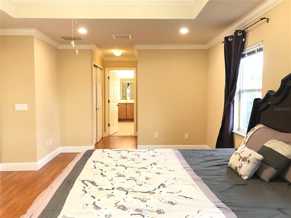 10505 Willow Ridge Loop Orlando, FL 32825 - Photo 26 of 45 a bedroom with a bed and a window