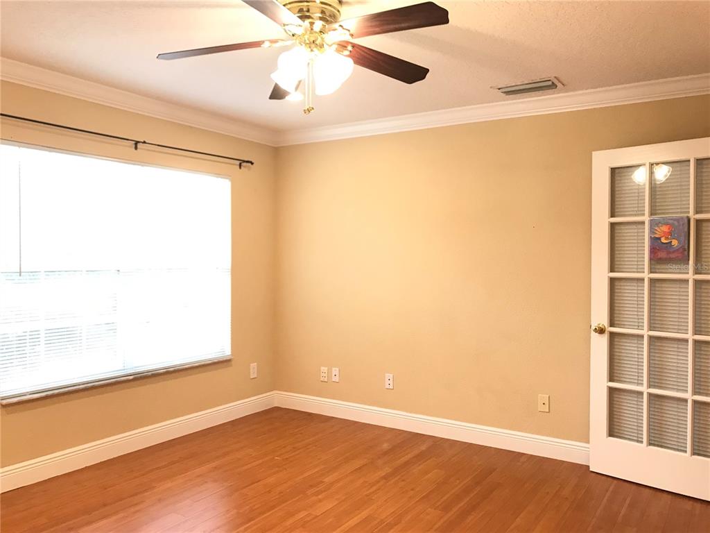 10505 Willow Ridge Loop Orlando, FL 32825 - Photo 32 of 45 a view of an empty room with a window and wooden floor
