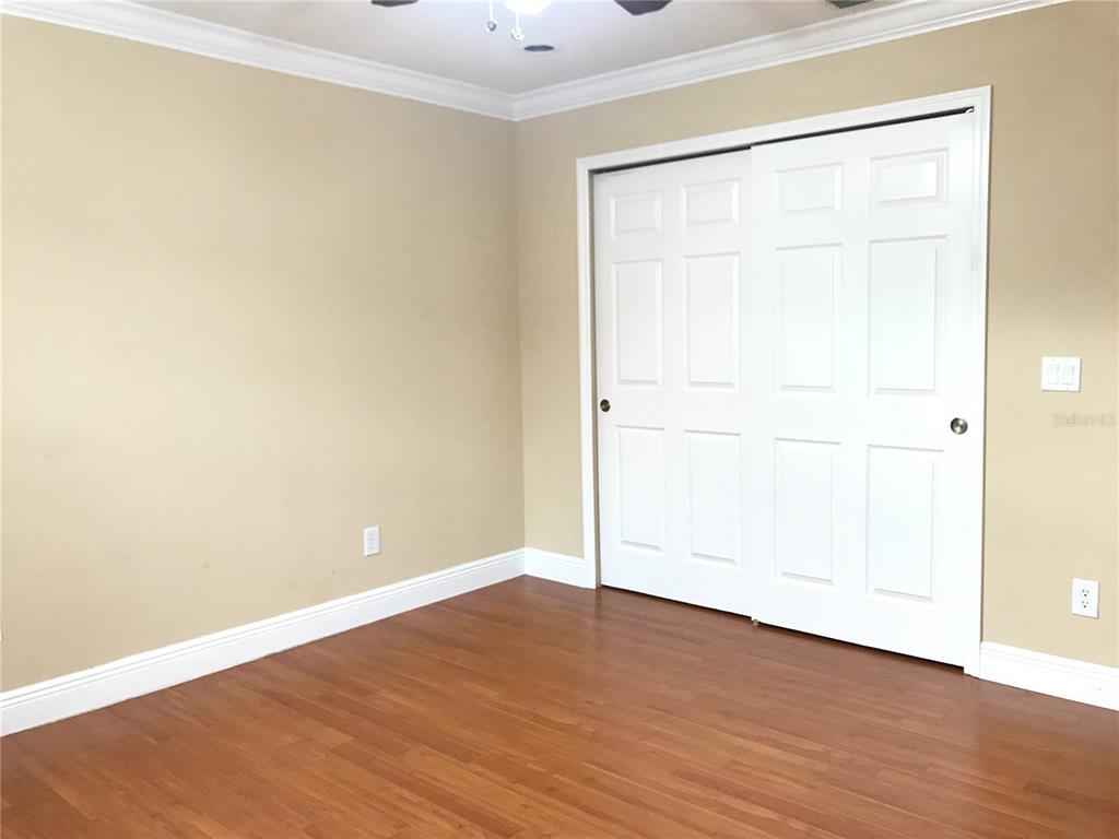 10505 Willow Ridge Loop Orlando, FL 32825 - Photo 36 of 45 an empty room with wooden floor