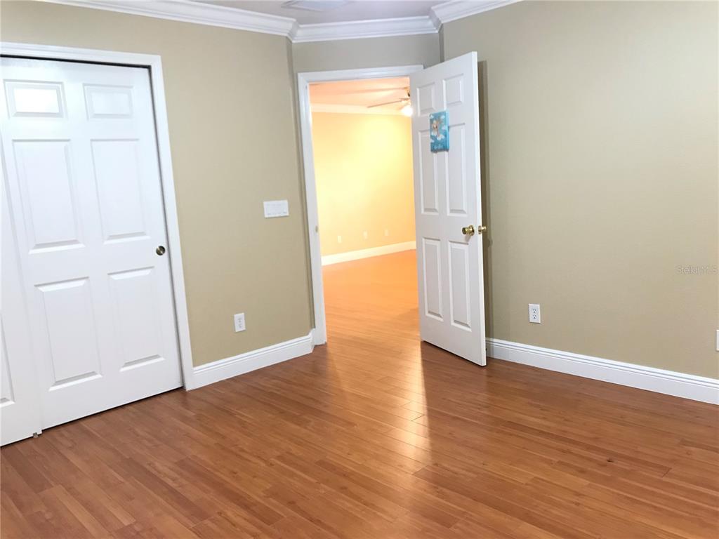 10505 Willow Ridge Loop Orlando, FL 32825 - Photo 38 of 45 an empty room with wooden floor and a window