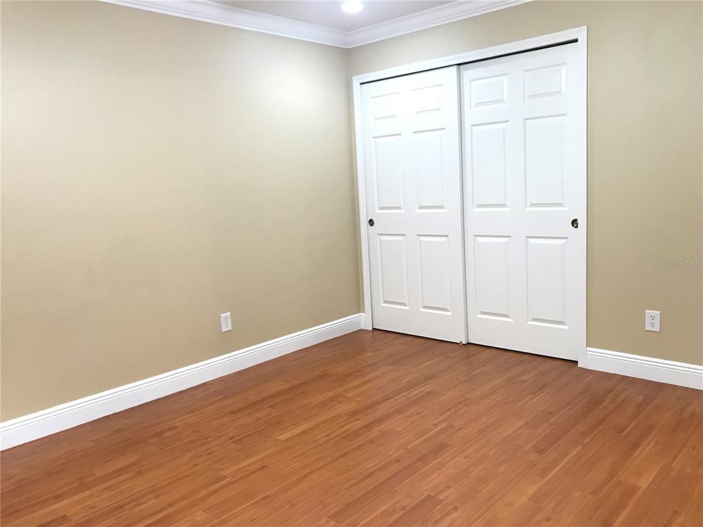 10505 Willow Ridge Loop Orlando, FL 32825 - Photo 39 of 45 a view of an empty room with wooden floor