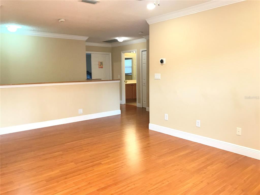 10505 Willow Ridge Loop Orlando, FL 32825 - Photo 42 of 45 a view of a big room with wooden floor and windows