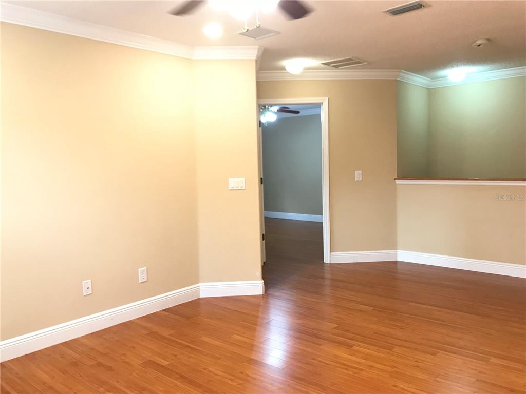 10505 Willow Ridge Loop Orlando, FL 32825 - Photo 43 of 45 a view of an empty room with wooden floor