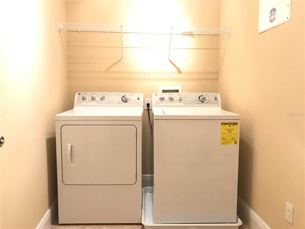 10505 Willow Ridge Loop Orlando, FL 32825 - Photo 44 of 45 a utility room with dryer and washer
