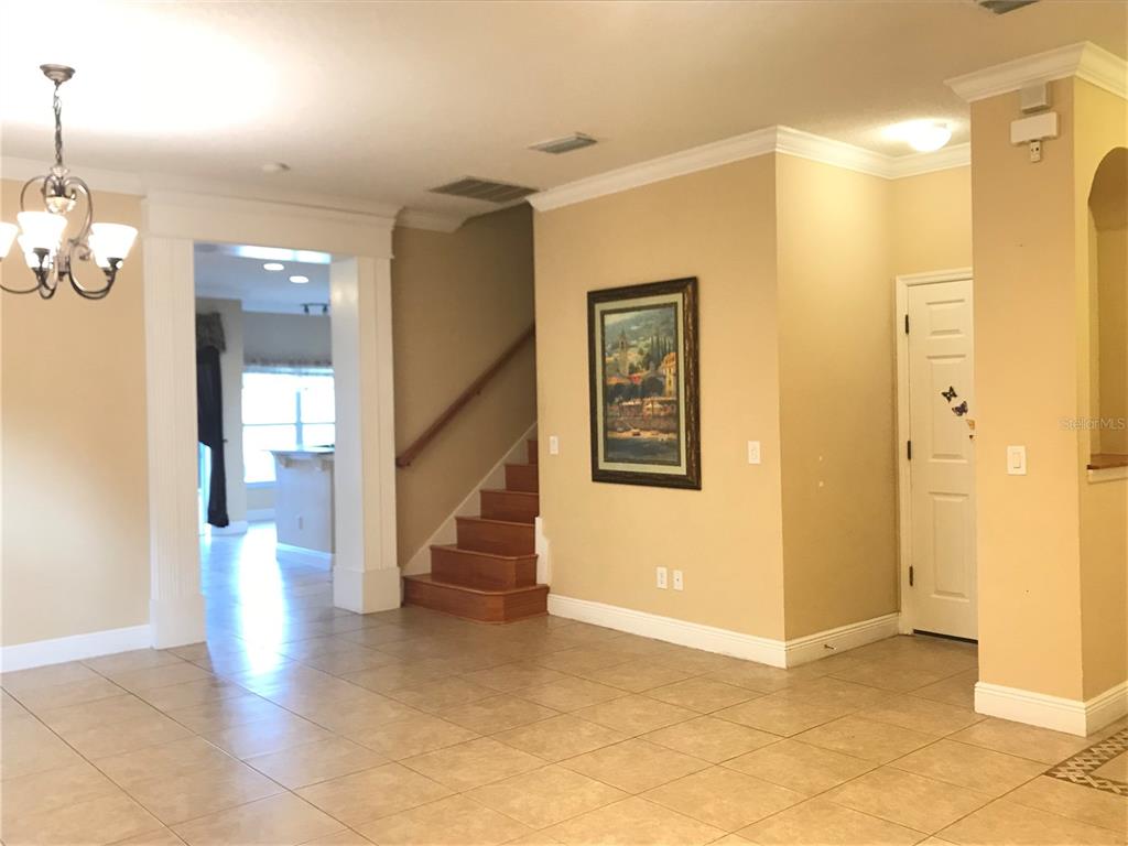 10505 Willow Ridge Loop Orlando, FL 32825 - Photo 8 of 45 a view of entryway with wooden floor