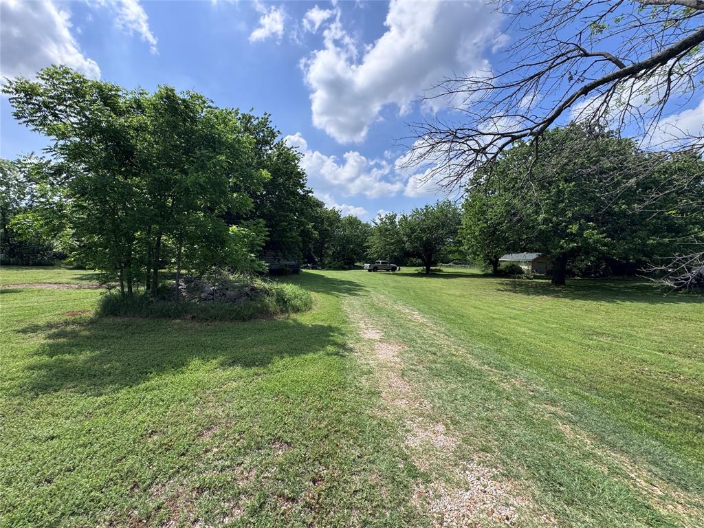 806 Old Base Road Aurora, TX 76078 - Photo 16 of 23 a view of a field of grass and a tree