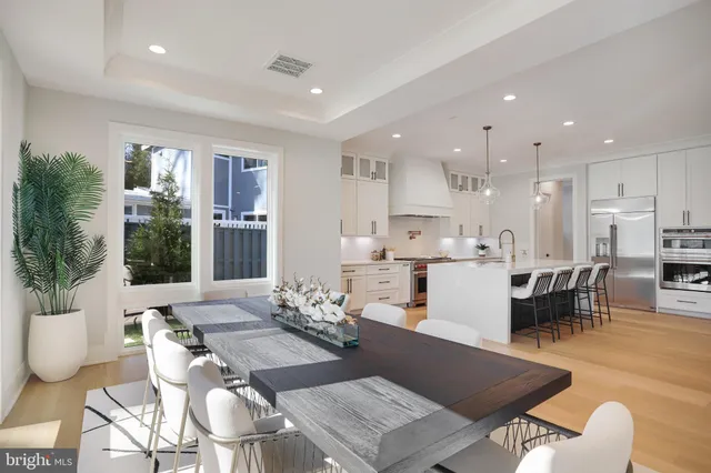 a spacious bedroom with a bed and a flat screen tv