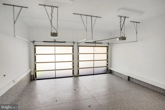 a living room with furniture a window and a table