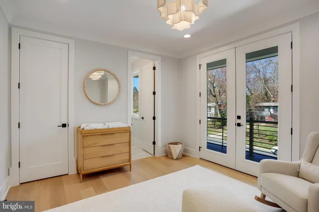 a bedroom with a bed and a potted plant