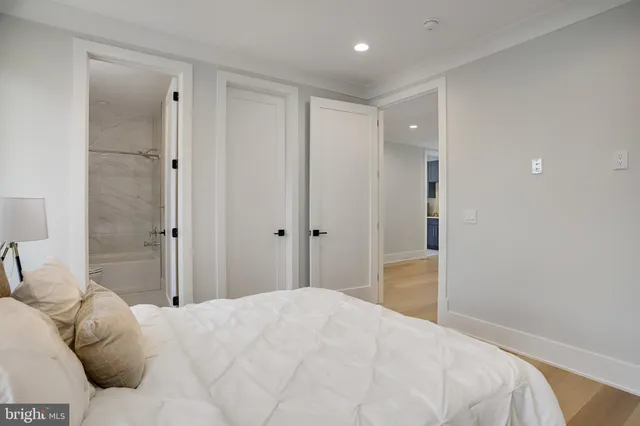 a view of room with stairs and wooden floor