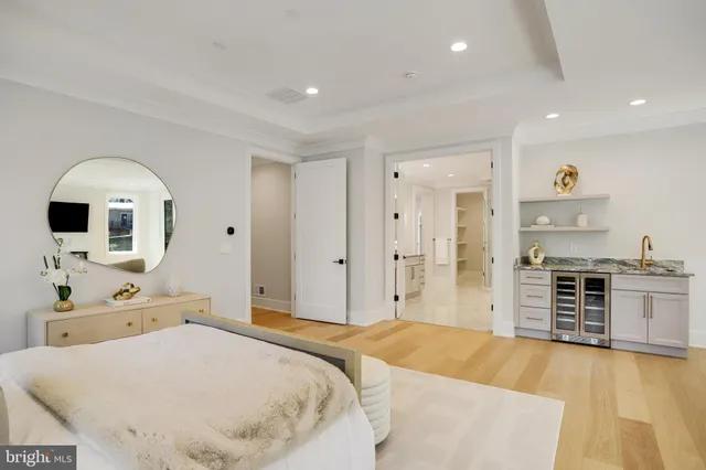 a bathroom with a sink mirror vanity and toilet