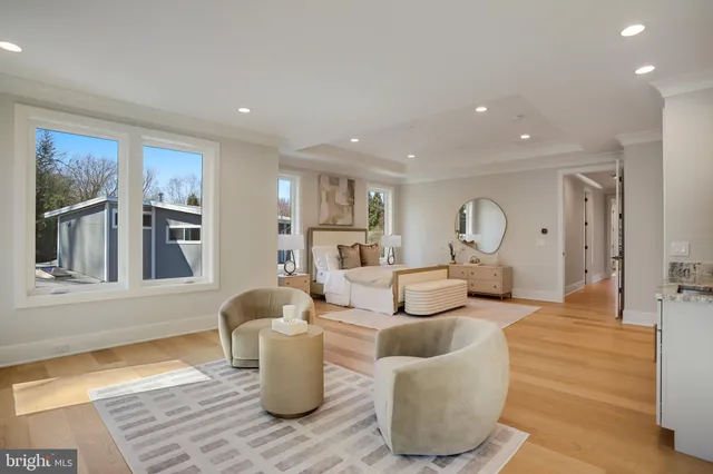 a living room with furniture and kitchen view