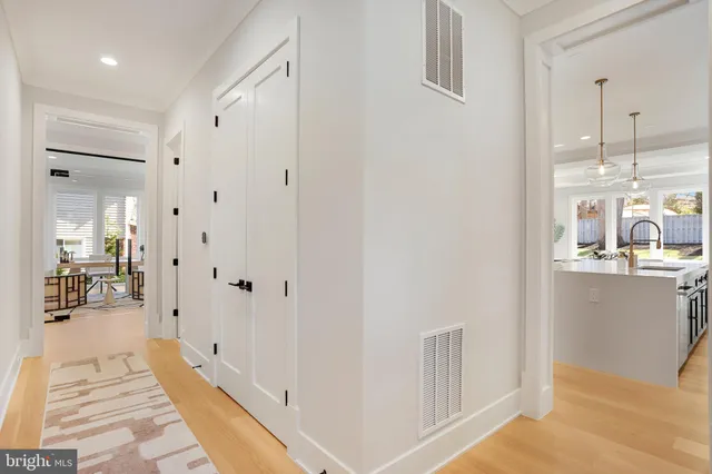 a view of a dining room with furniture large windows and wooden floor