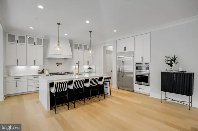 a view of a chairs and table on the wooden floor
