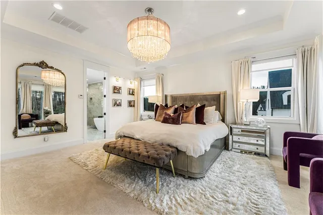 a view of a livingroom with furniture and a kitchen