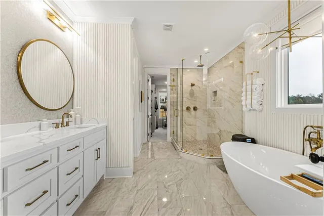 a view of swimming pool with seating area and trees in the background