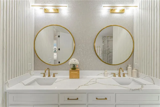 a living room with furniture large window and a fireplace
