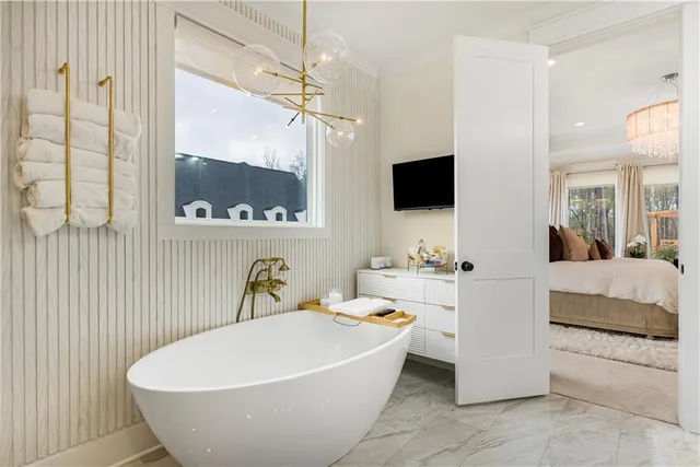 a bedroom with a sink and a mirror