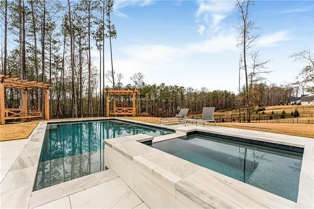 a view of a house with backyard and porch