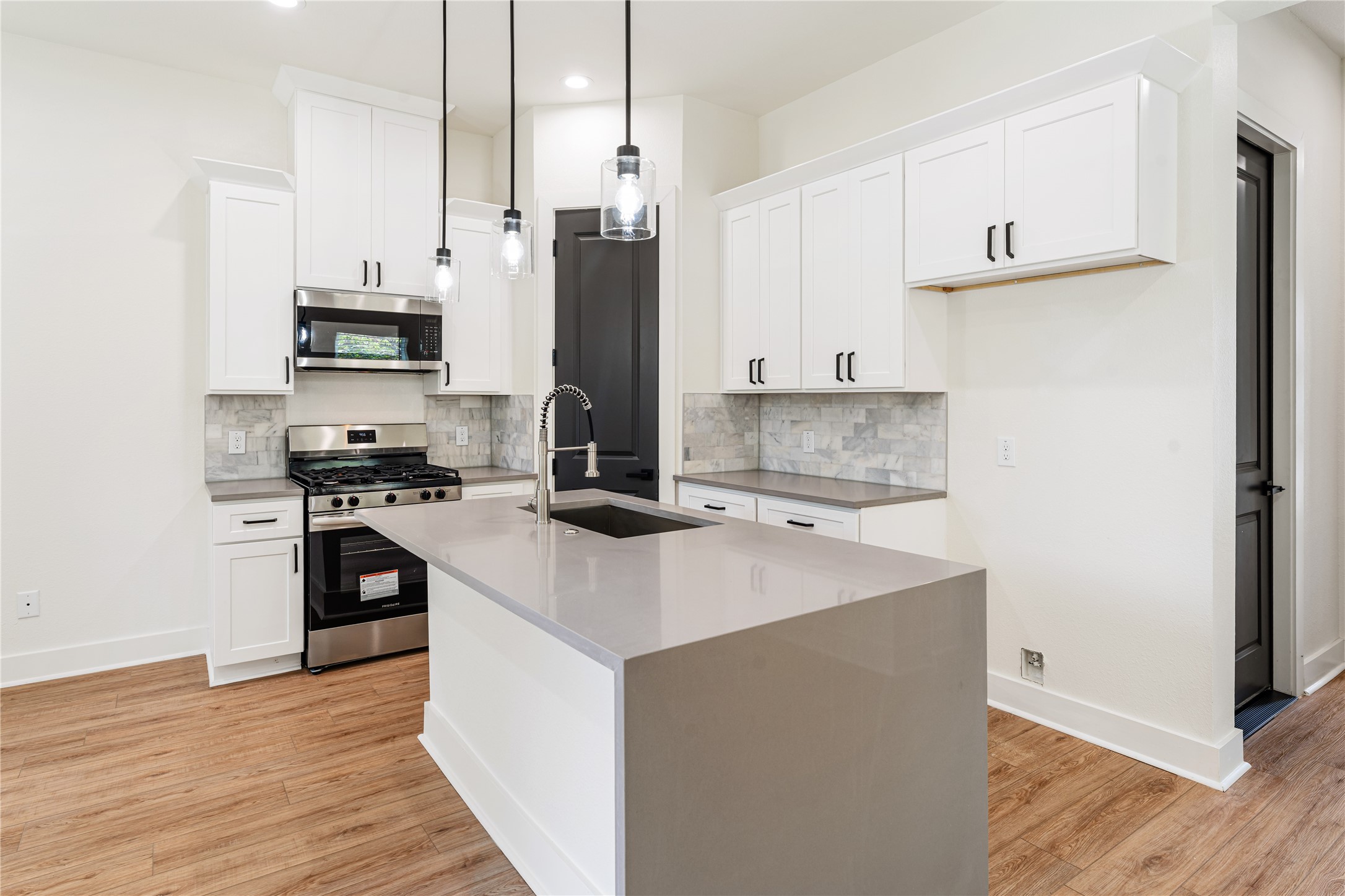 3620 Mt Pleasant Street, Unit A Houston, TX 77021 - Photo 5 of 23 a kitchen with stainless steel appliances a stove refrigerator sink and cabinets