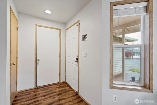 a view of a bathroom with wooden floor
