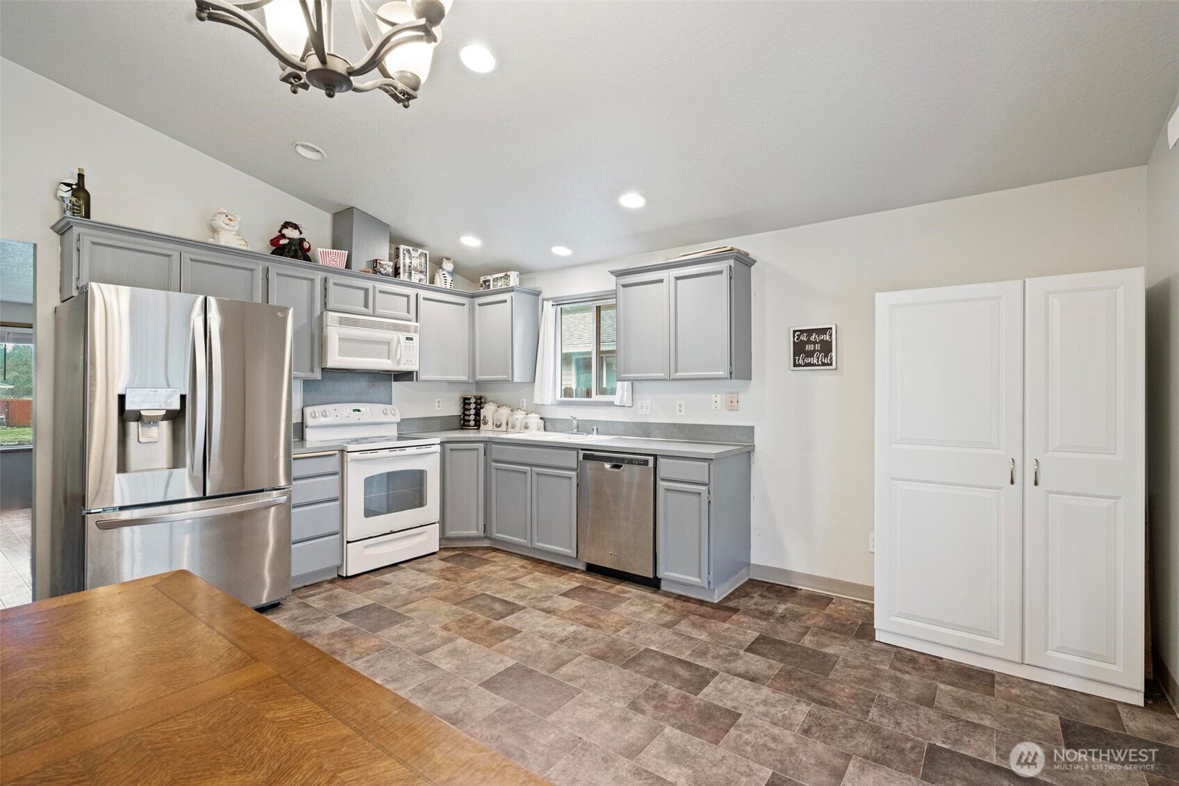 106 Rose Marie Drive Chehalis, WA 98532 - Photo 7 of 25 a kitchen with refrigerator cabinets and white appliances