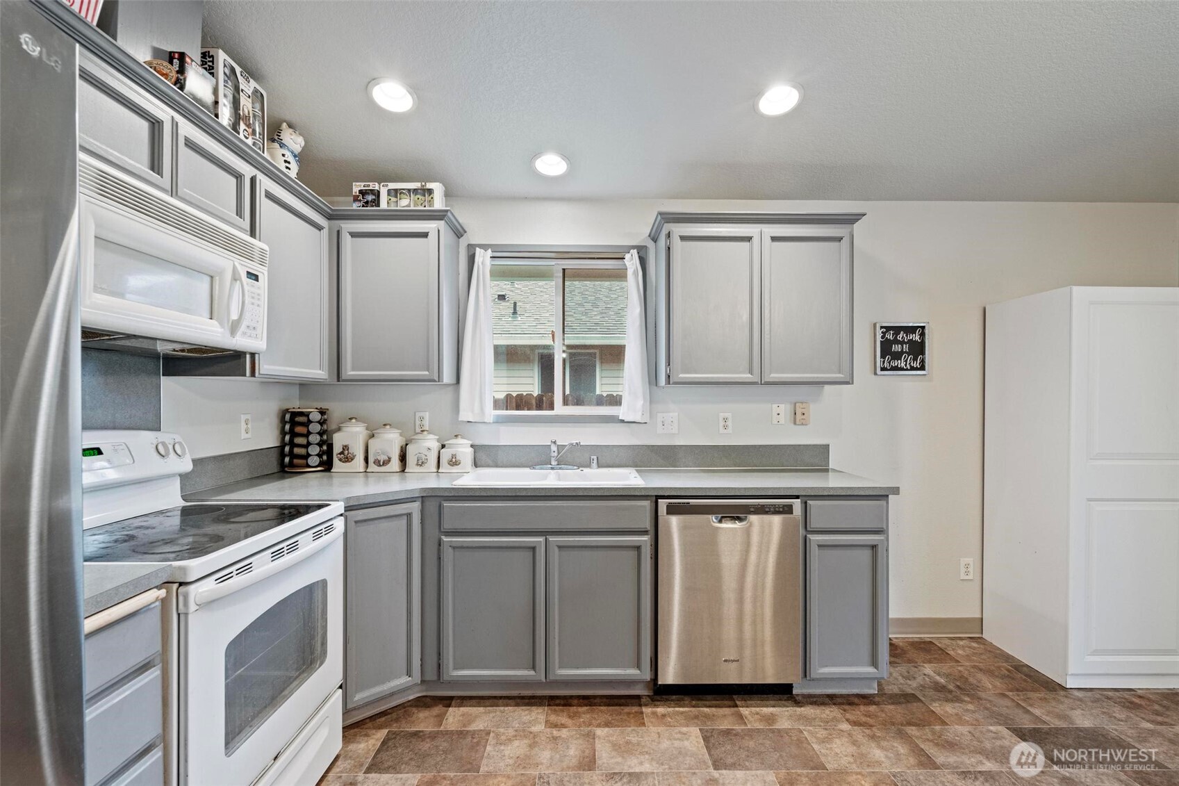 106 Rose Marie Drive Chehalis, WA 98532 - Photo 8 of 25 a kitchen with a sink stove and cabinets