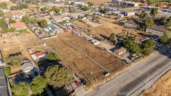 an aerial view of residential houses with city view