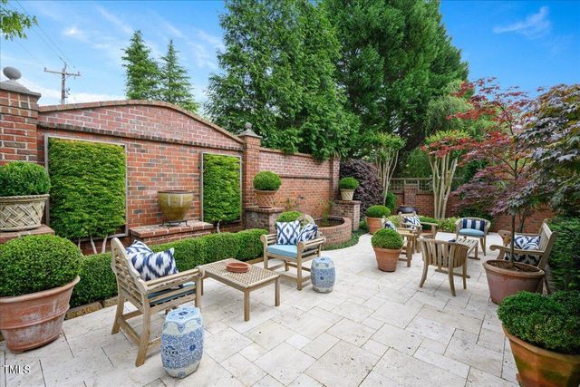 a view of a patio with couches and potted plants