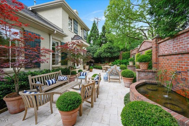 a view of a patio with a chairs and table in a patio