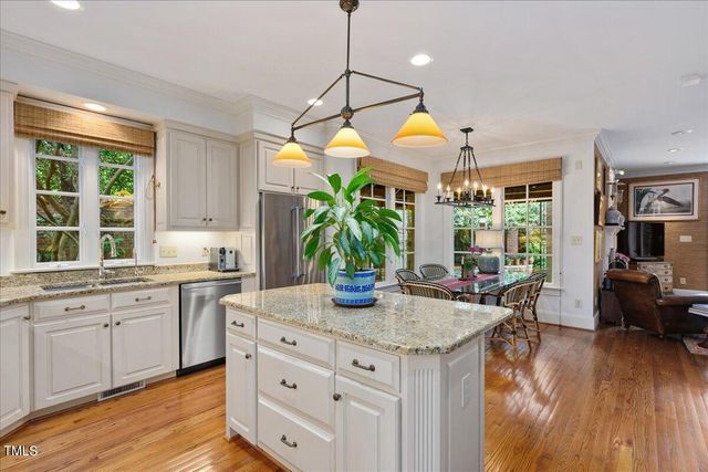a kitchen that has a lot of cabinets in it