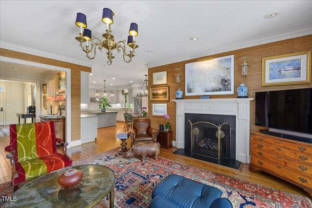 a living room with fireplace furniture and a flat screen tv