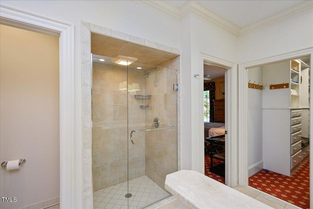 a bathroom with a shower and a toilet