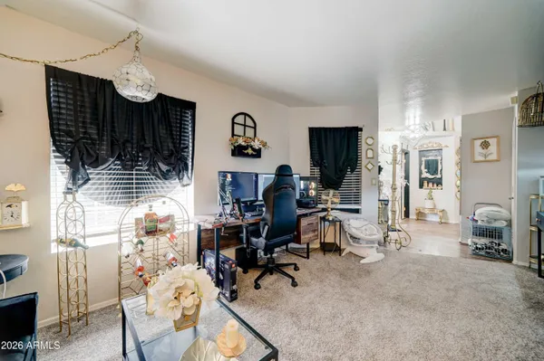 a view of a livingroom with furniture and gym equipment