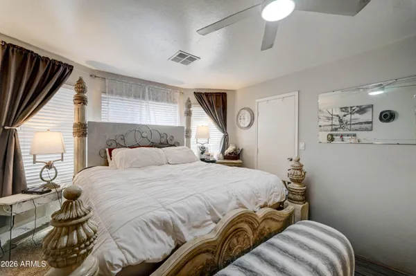 a bedroom with a bed and a window