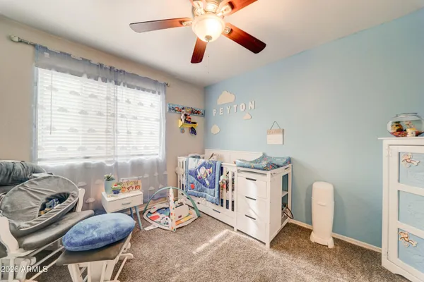 a bedroom with furniture and a chandelier