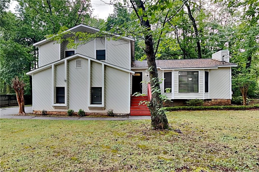 464 Ridgemont Drive Lawrenceville, GA 30046 - Photo 1 of 22 a front view of house with yard