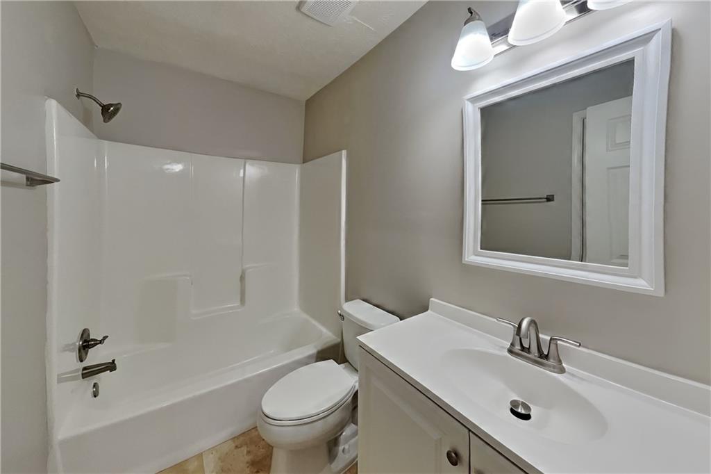 464 Ridgemont Drive Lawrenceville, GA 30046 - Photo 15 of 22 a bathroom with a sink toilet and shower