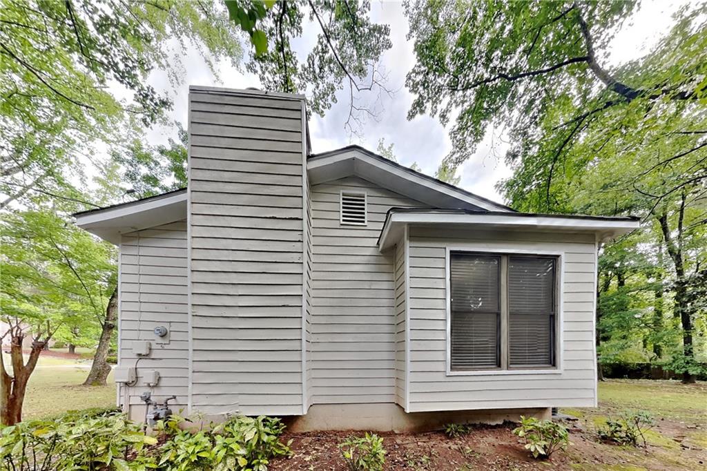 464 Ridgemont Drive Lawrenceville, GA 30046 - Photo 17 of 22 a front view of a house with a garden