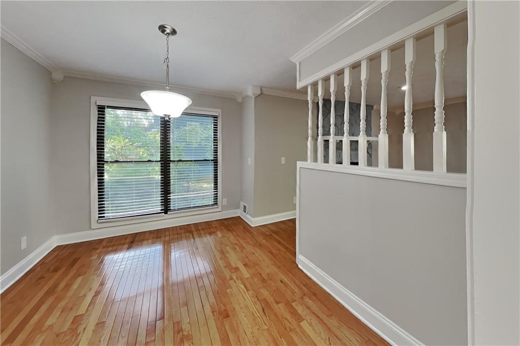 464 Ridgemont Drive Lawrenceville, GA 30046 - Photo 6 of 22 a view of wooden floor and a chandelier in a room