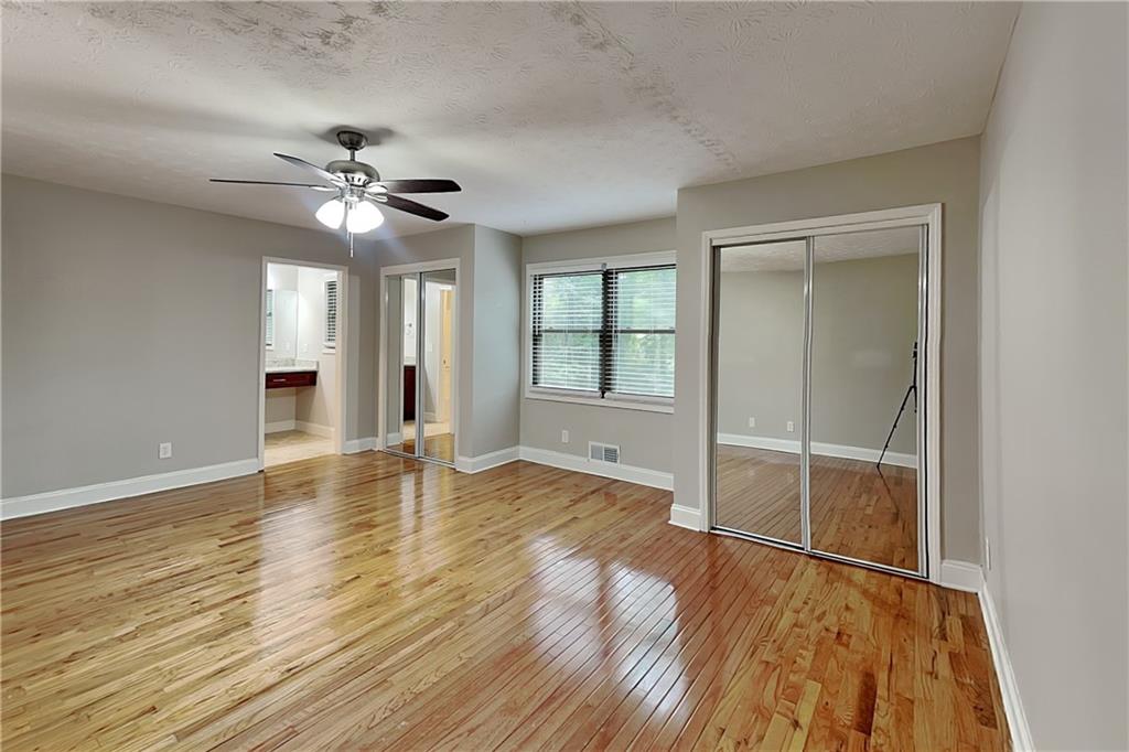 464 Ridgemont Drive Lawrenceville, GA 30046 - Photo 8 of 22 wooden floor in an empty room with a window